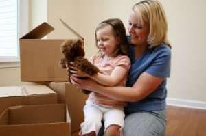 Parent and child preparing for a house move